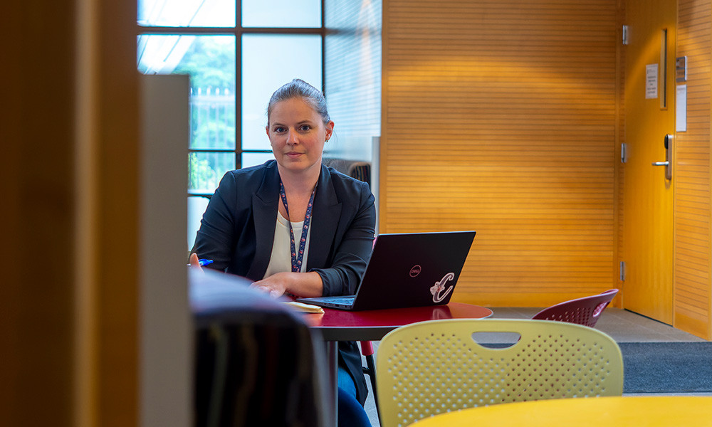 Dr. Christine Voss sitting at a desk